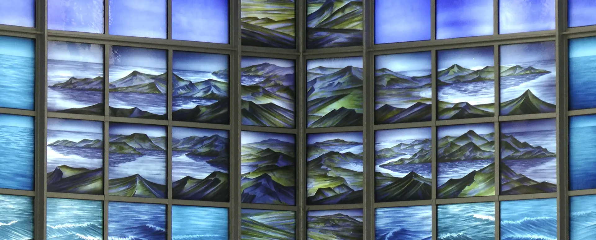 falklands Stillhouse Window - Section of the 10-metre fused glass artwork with copper stills in the background