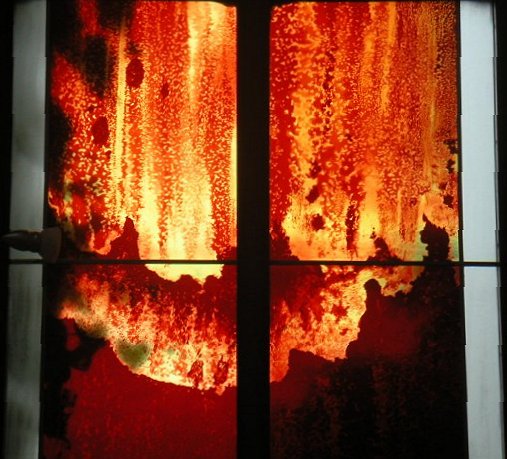 Fire window — amber and gold flashed glass, acid etched