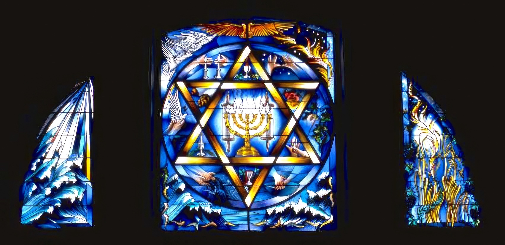The Sabbath window — a large triptych high on the West Wall, Queens Park Synagogue Glasgow