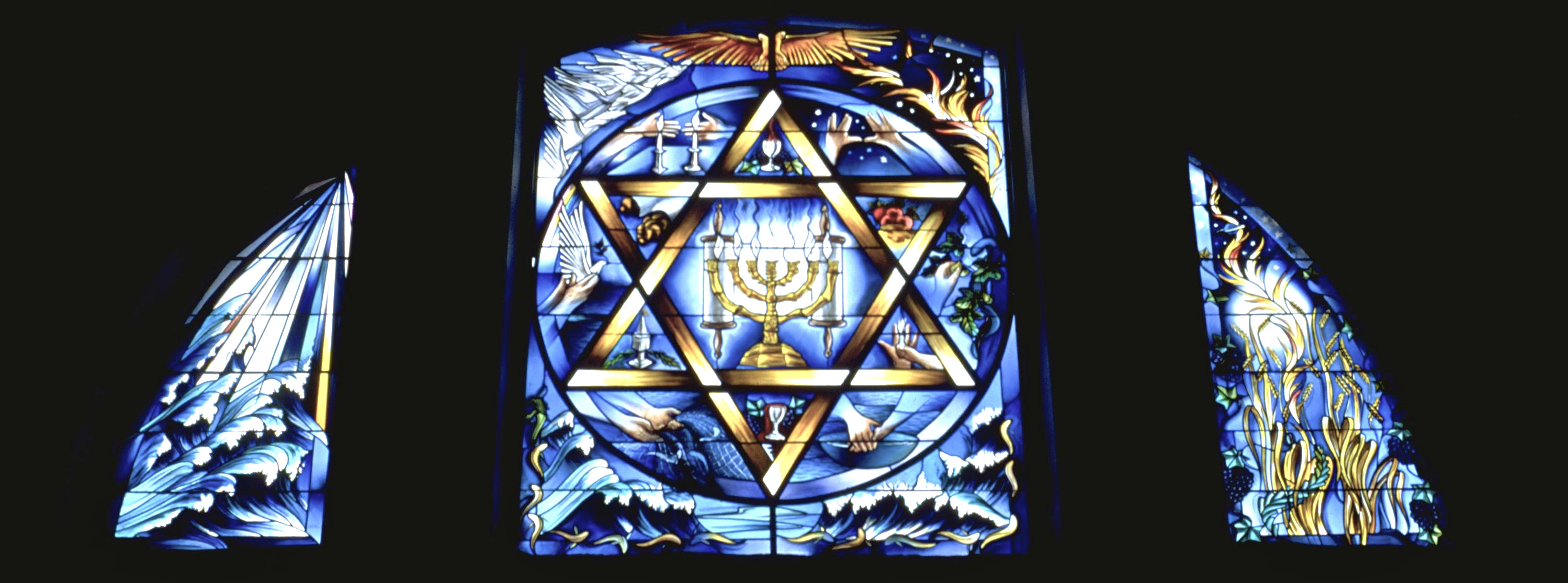 The Sabbath window — a large triptych high on the West Wall, Queens Park Synagogue Glasgow